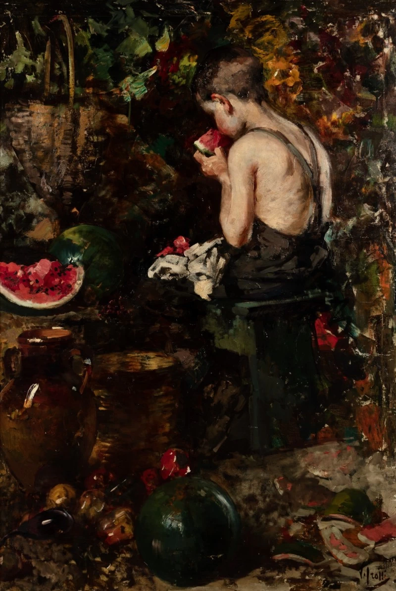 Giovane ragazzo che mangia l'anguria
